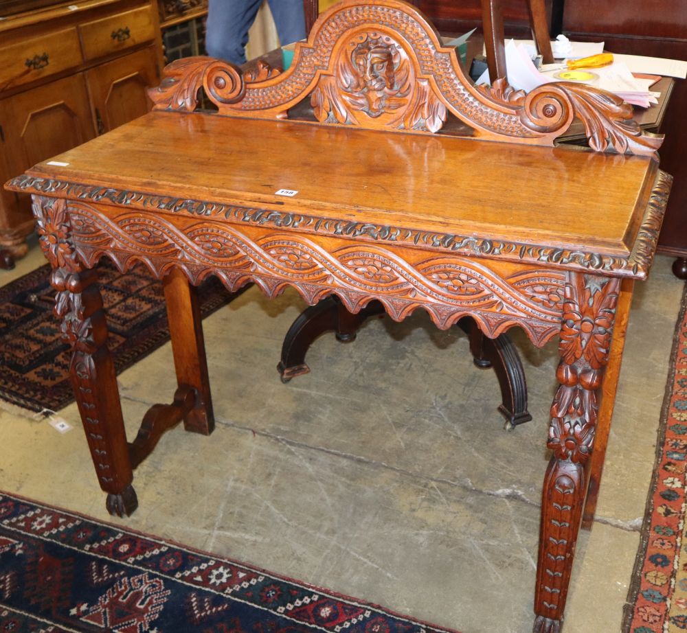 A late 19th century Flemish carved oak hall table, W.108cm, D.44cm, H.104cm
